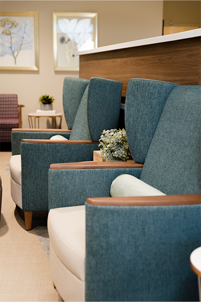 Affina lounge chair with wingback and wood arms